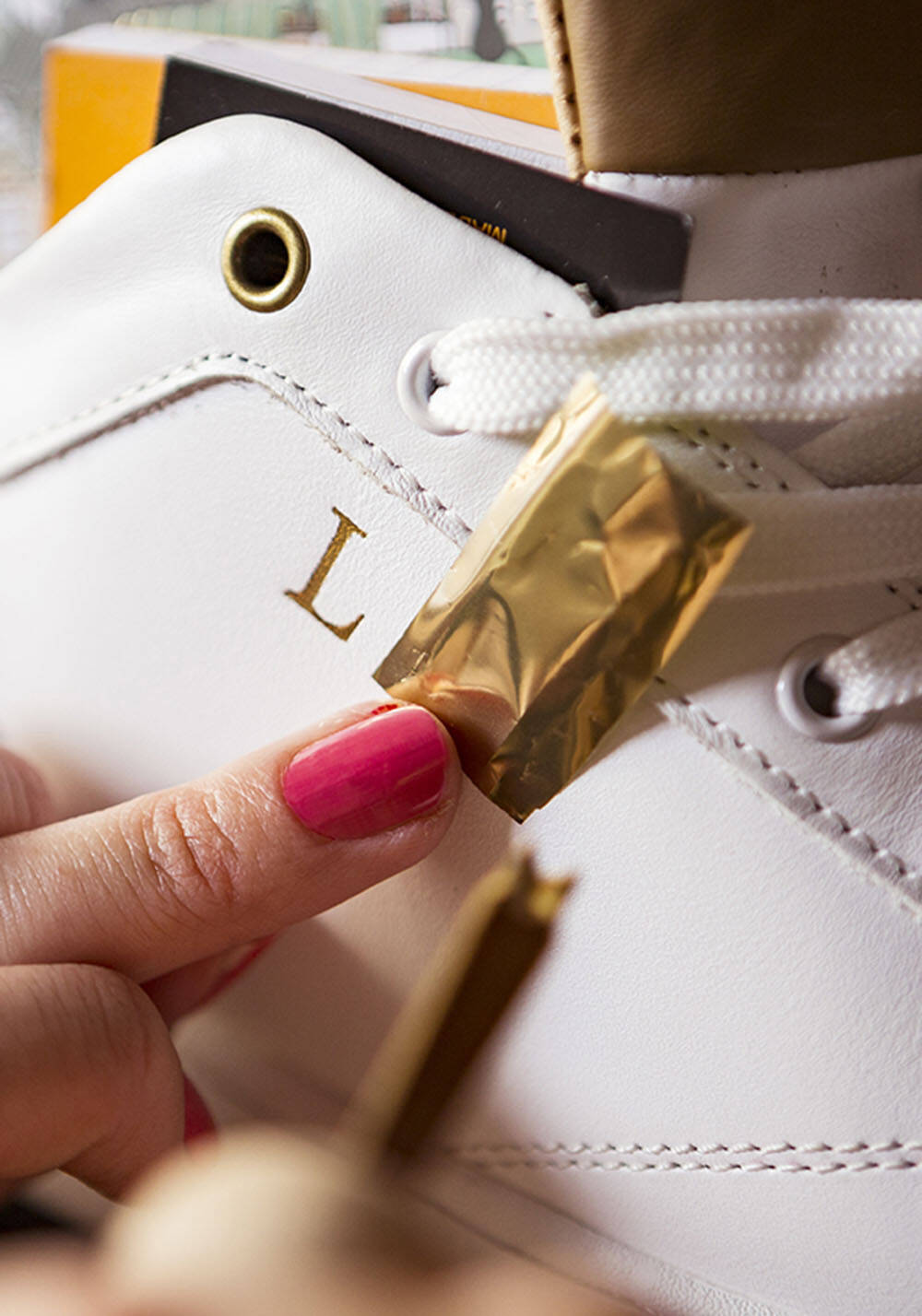 Gold branded sneakers